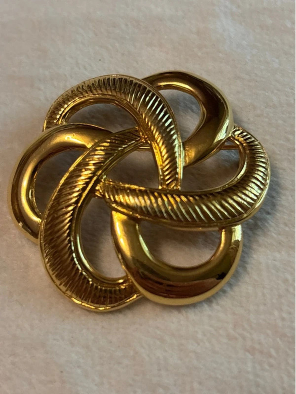 Stamped Monet Gold Tone Swirl Knot Brooch